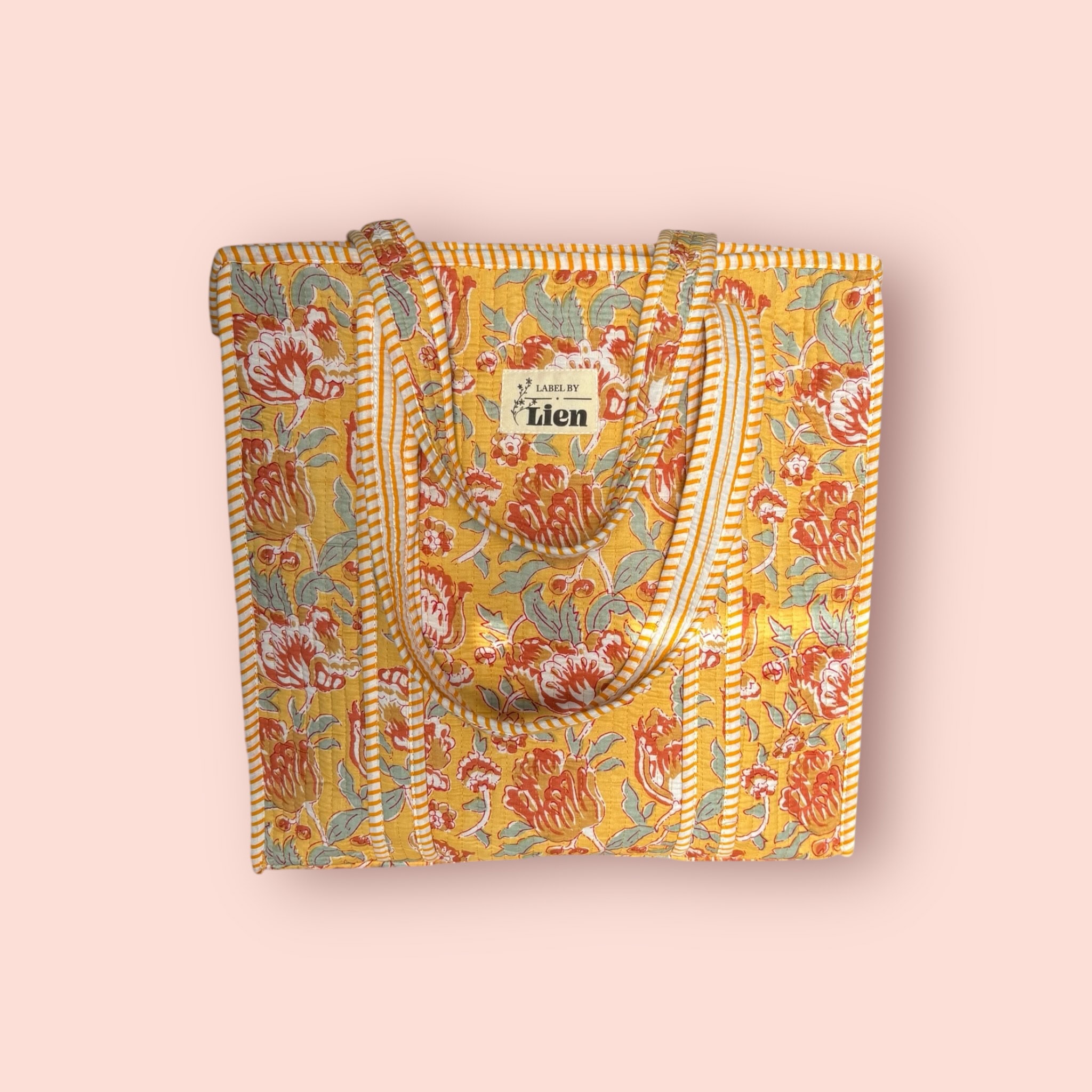 tote bag geel met bloemenprint en quilted design